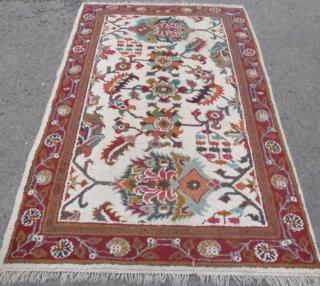 Appraisal: Cream ground rug the centre with styalised foliate forms cm