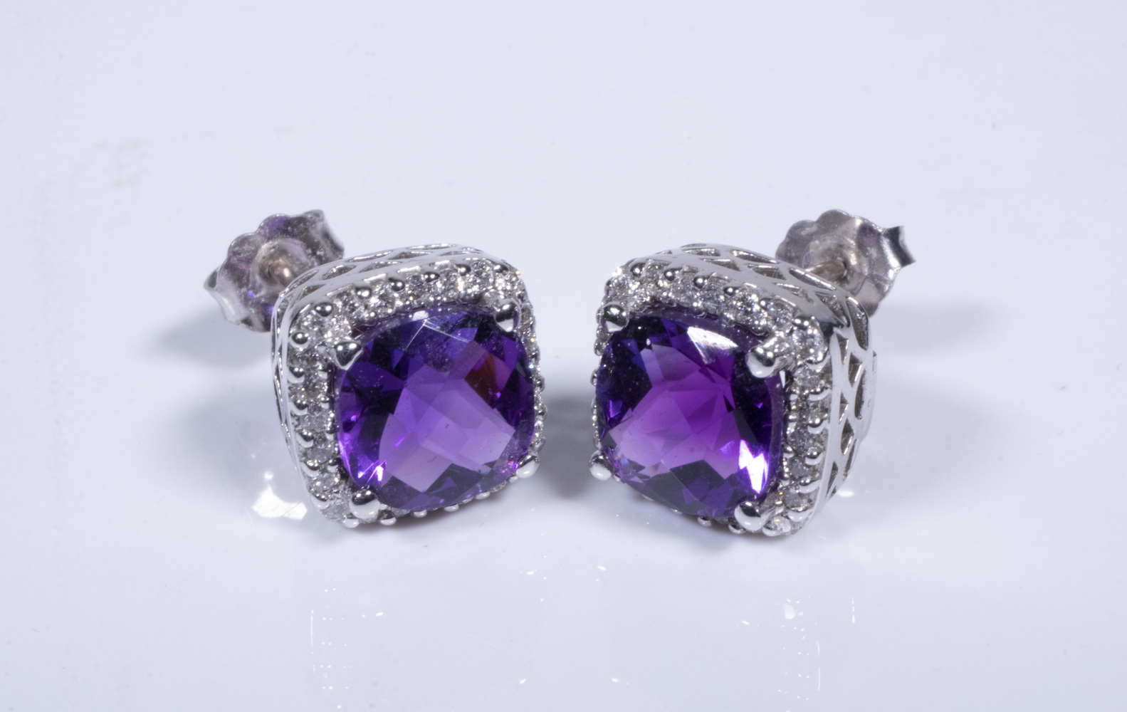 Appraisal: K WHITE GOLD AMETHYST AND DIAMOND STUD EARRINGS Pair of