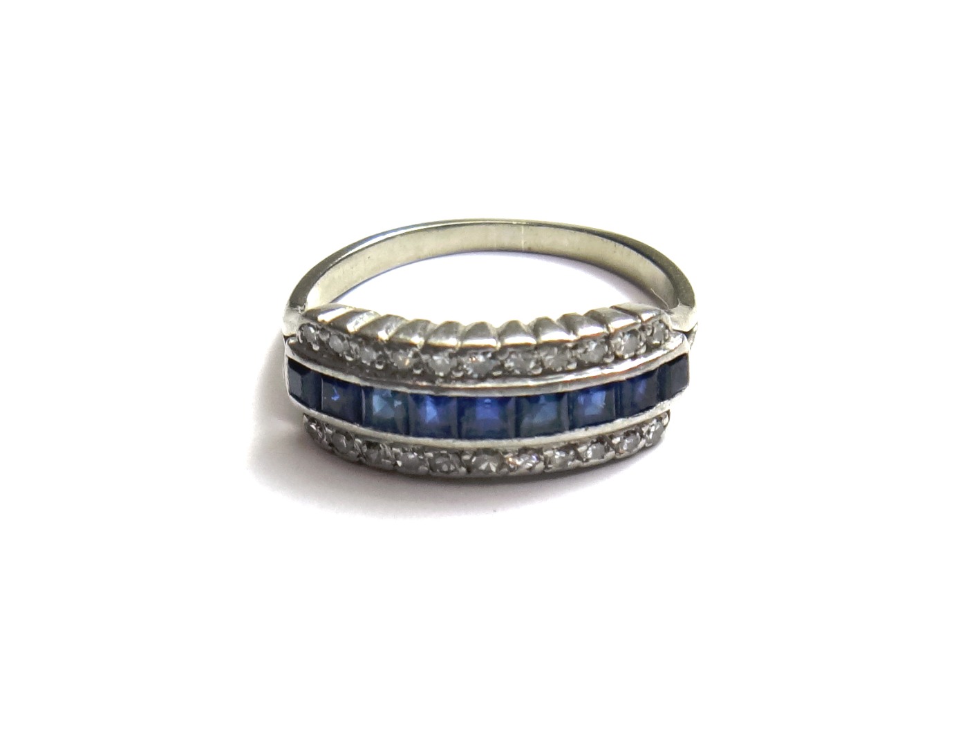 Appraisal: A sapphire and diamond set half hoop ring mounted with