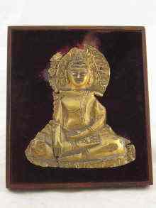 Appraisal: An antique high carat gold Tibetan gold Buddha mounted on