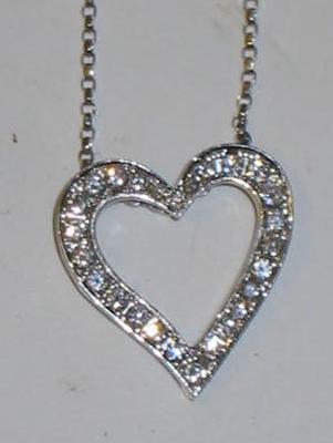 Appraisal: A DIAMOND SET HEART PENDANT the slightly asymmetric heart pave