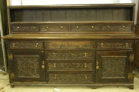 Appraisal: th century carved oak dresser the top with four drawers