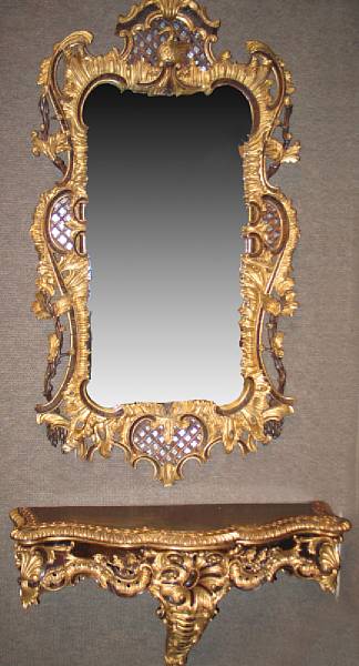 Appraisal: A Rococo style ebonzied and parcel gilt console with mirror