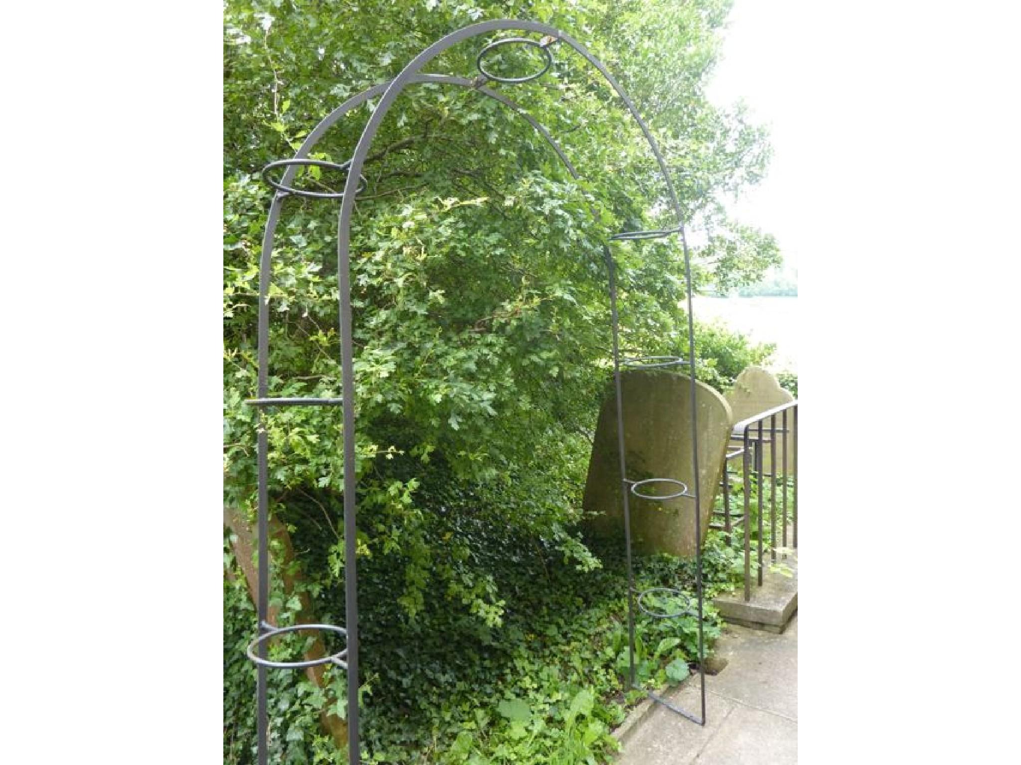 Appraisal: A simple iron work rose arch the framework with integral