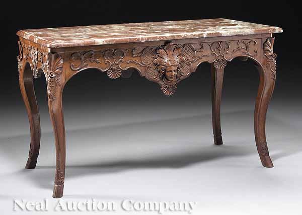 Appraisal: A French R gence Carved Walnut Table with Rouge Marble