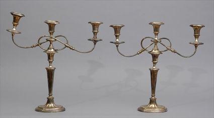 Appraisal: PAIR OF GEORGE III SHEFFIELD PLATE THREE-LIGHT CANDELABRA Each tapered