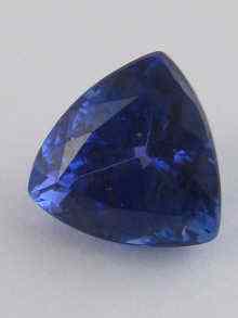 Appraisal: A loose polished tanzanite of fine colour triangular cut approx