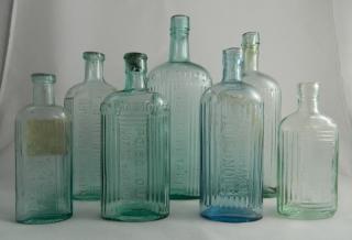 Appraisal: Poison aqua oval bottles Poison- aqua oval all embossed with