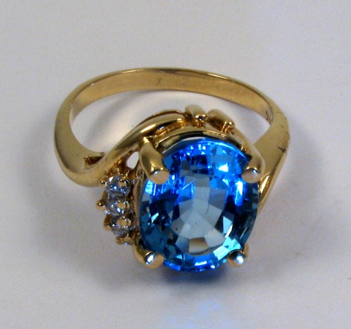 Appraisal: BLUE TOPAZ AND DIAMOND RING k yellow gold and set