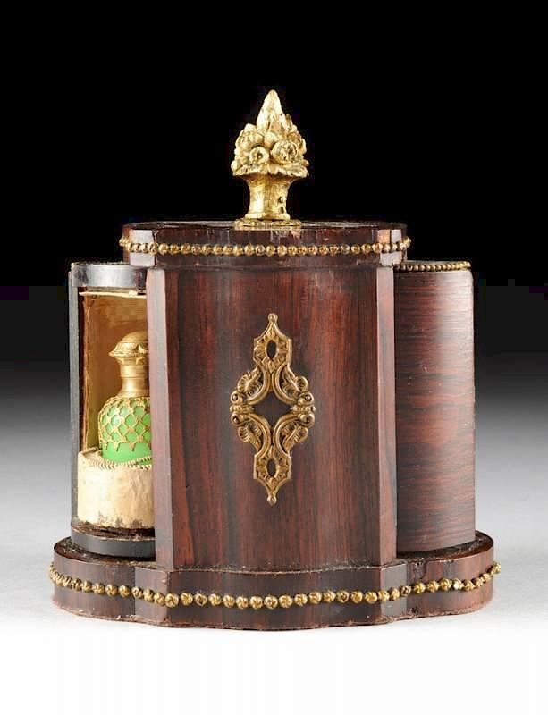 Appraisal: A FRENCH ROSEWOOD VENEER AND GILT BRONZE MECHANICAL REVOLVING TWO