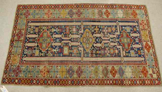 Appraisal: SEMI-ANTIQUE CAUCASIAN KUBA AREA RUG c - geometric and stylized