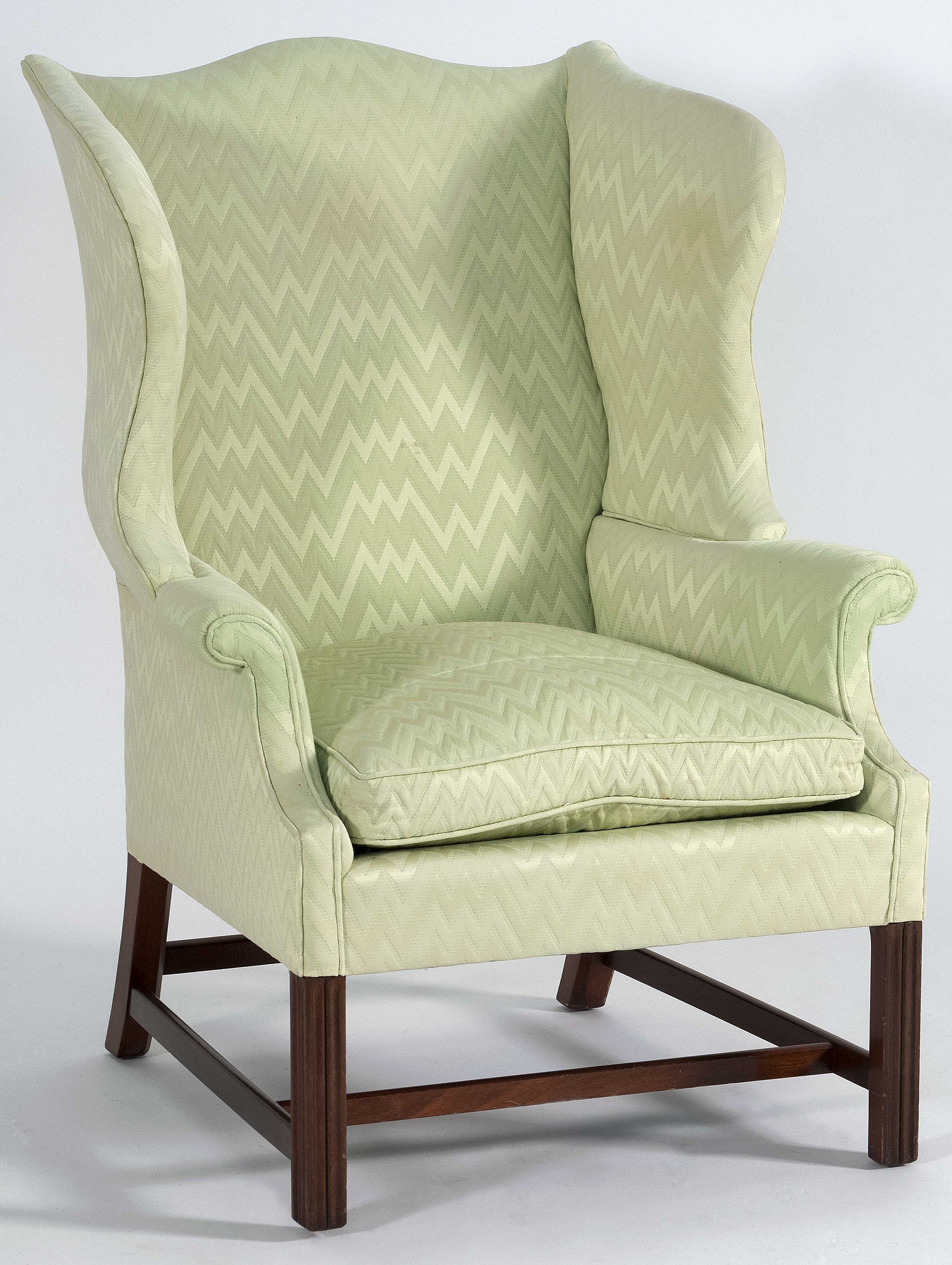 Appraisal: CHIPPENDALE-STYLE WING CHAIR With lime green upholstery Molded block front