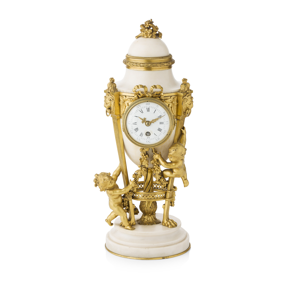 Appraisal: FRENCH CARRARA MARBLE AND ORMOLU URN FORM CLOCK IN THE