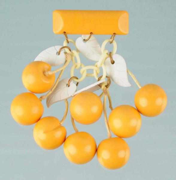 Appraisal: Bakelite Butterscotch Queen Anne Cherries Brooch Description Attached with brass