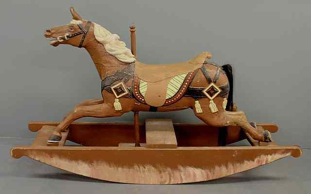 Appraisal: Continental carved galloping carousel horse c with glass eyes mounted