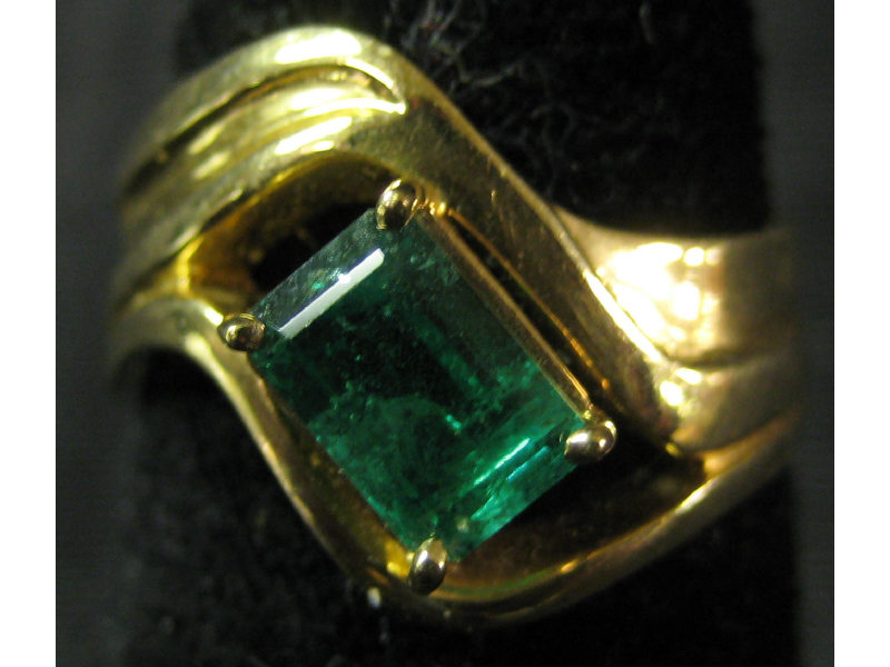 Appraisal: EMERALD RING k yellow gold contemporary design ring set with