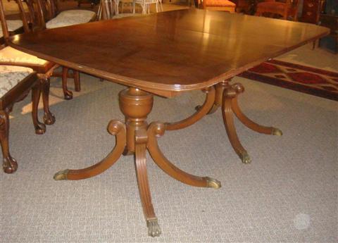 Appraisal: REGENCY STYLE MAHOGANY BANDED PEDESTAL TABLE WITH TWO LEAVES h