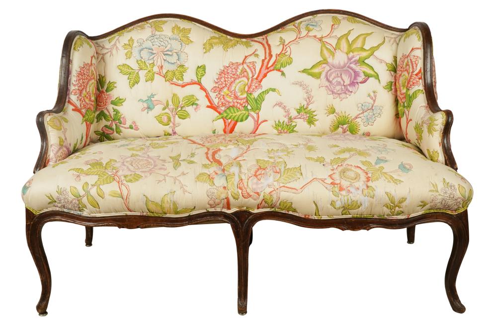 Appraisal: LOUIS XV STYLE CARVED WOOD CANAPEcovered with quilted floral fabric