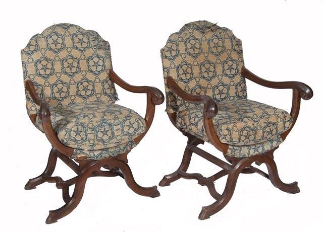 Appraisal: A PAIR OF ITALIAN WALNUT FRAMED ARM CHAIRS upholstered in