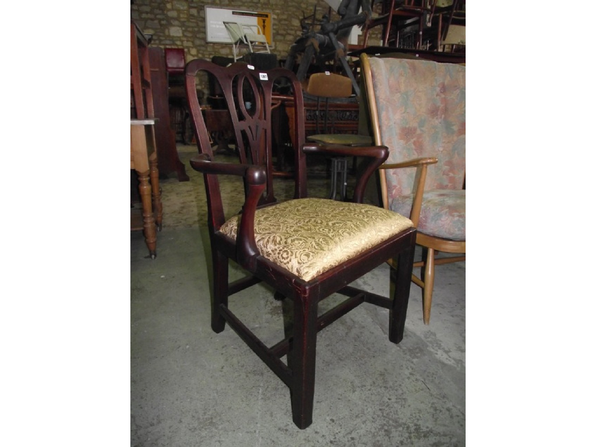 Appraisal: A Georgian mahogany open elbow chair with central pierced slat