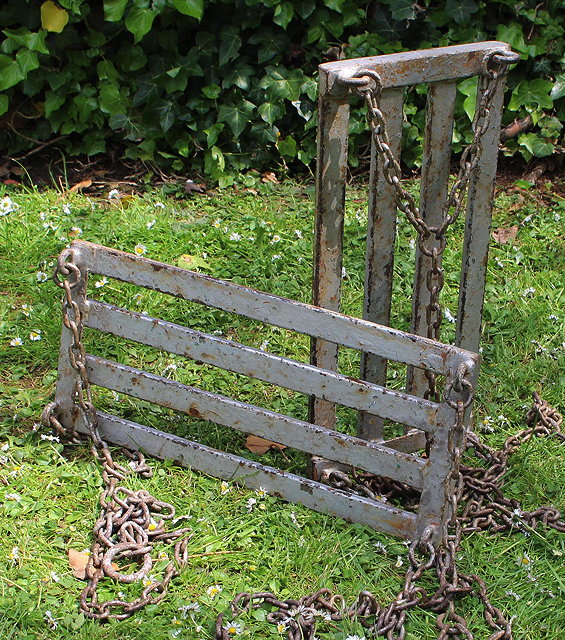 Appraisal: A PAIR OF SILVER PAINTED WROUGHT IRON CHILD'S SWING SEATS