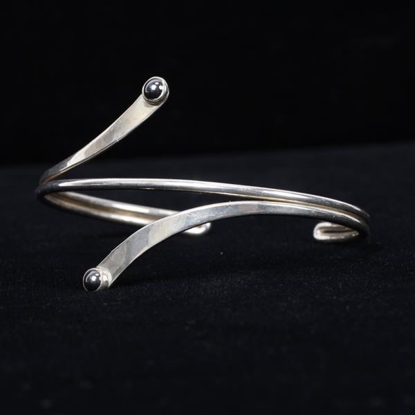 Appraisal: Sterling silver bypass cuff bracelet with hematite accents Marked Sterling