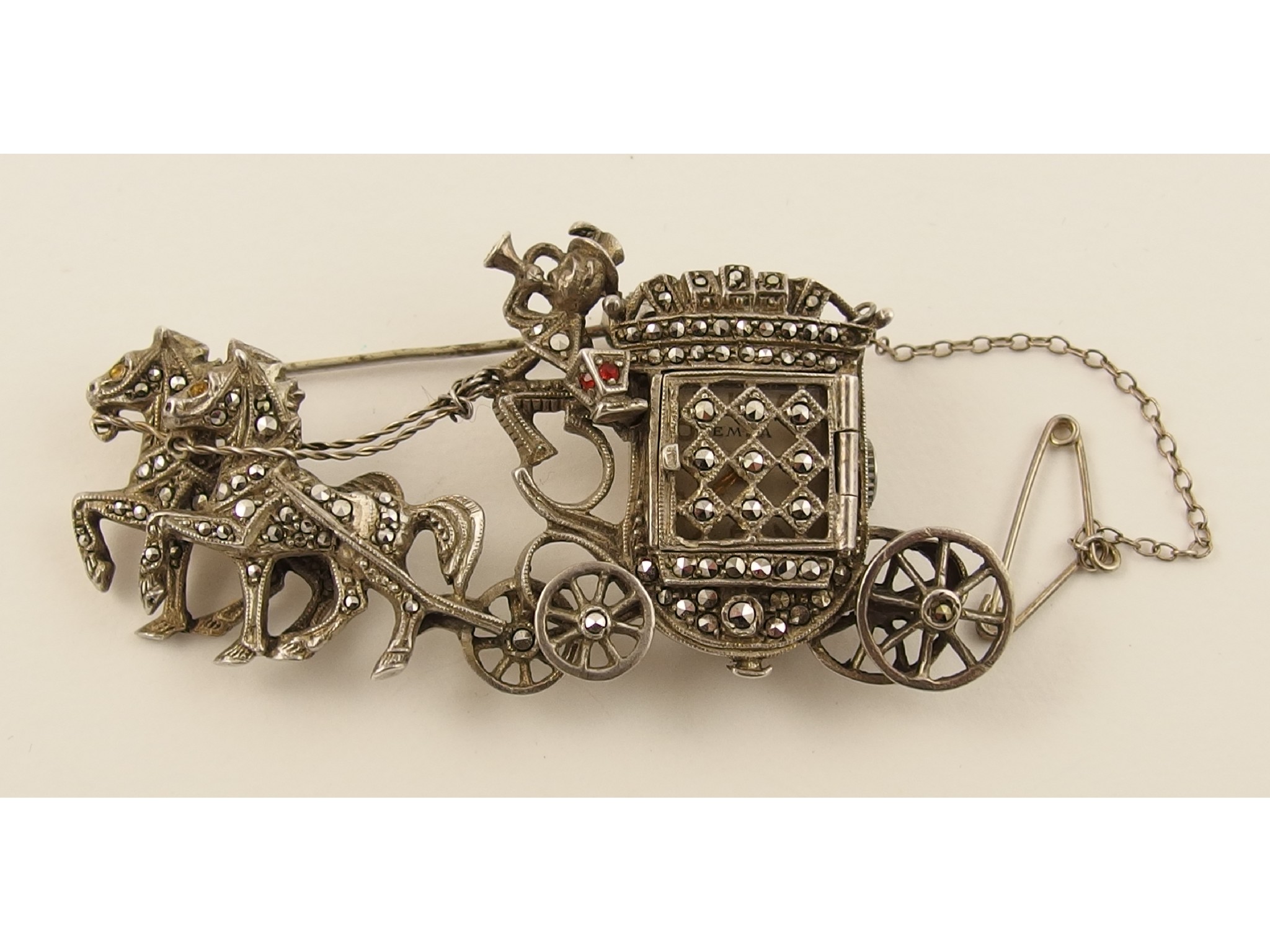 Appraisal: A retro silver horse and carriage brooch with a concealed