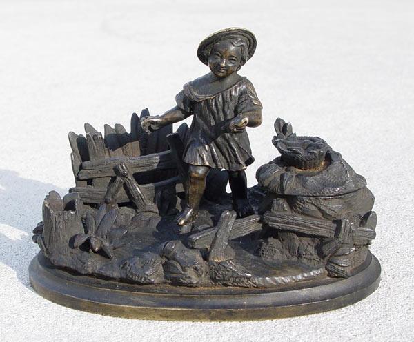 Appraisal: BRONZE INKWELL OF A GIRL IN FIELD Missing glass insert