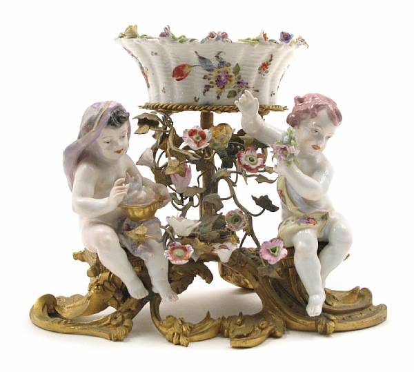 Appraisal: A French bronze and porcelain mounted centerpiece height in width