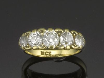 Appraisal: A diamond five stone ring The graduated old circular cut