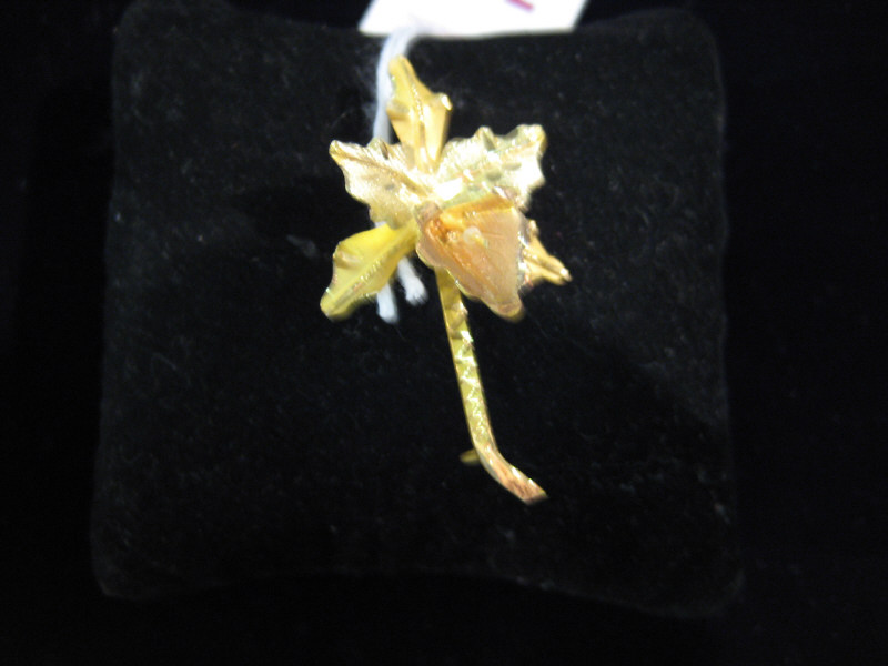 Appraisal: ORCHID BROOCH k yellow and rose gold brooch in the