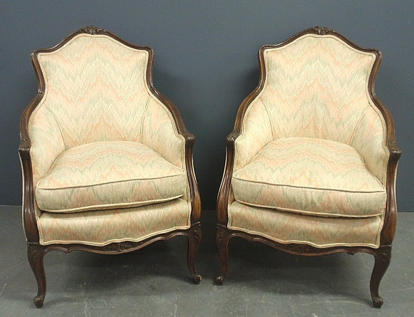 Appraisal: - Pair of French carved walnut armchairs early th c