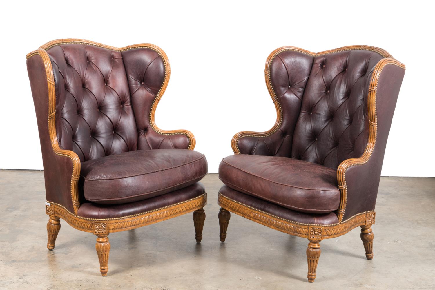 Appraisal: PAIR MAITLAND-SMITH OVERSIZED LEATHER WING CHAIRS Pair of Maitland-Smith oversized