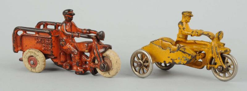 Appraisal: Lot Of Cast Iron Police Motorcycle Toys The crash car