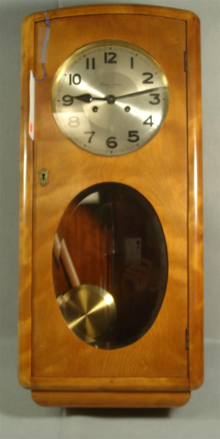 Appraisal: Austrian wall clock by Franz Kainz Wien oval beveled glass