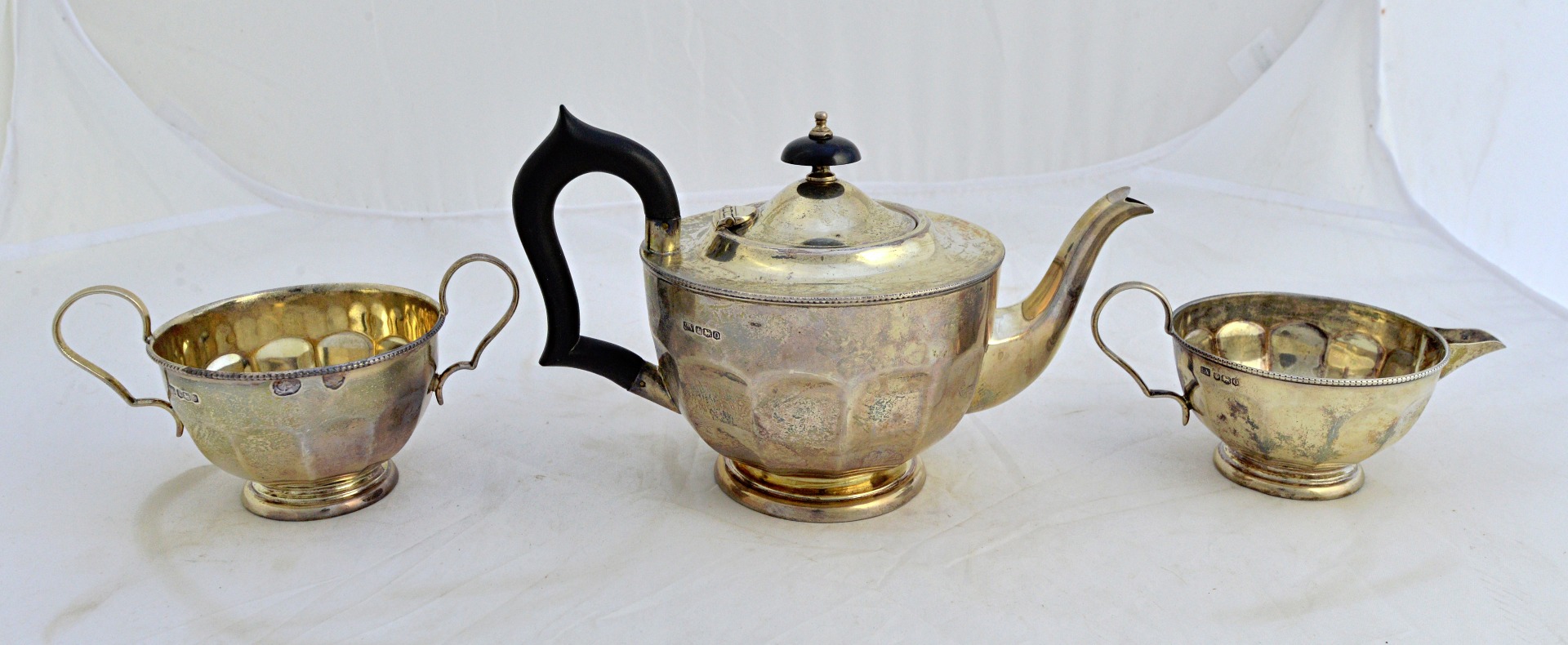 Appraisal: A silver three piece tea set comprising a teapot a