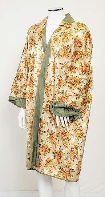 Appraisal: A handmade silk overcoat with a beige floral design green