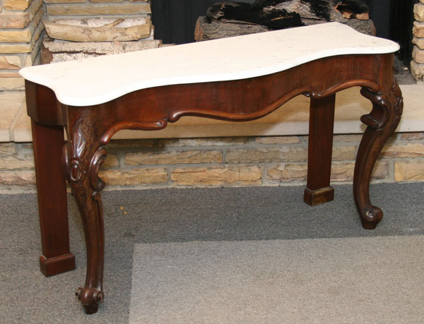 Appraisal: Victorian mahogany marble top table serpentine front beveled edge carved