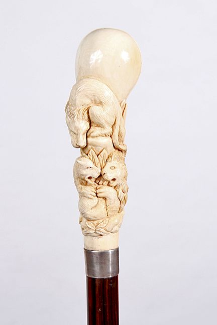 Appraisal: Mammoth Lion Cane Century- A mammoth ivory high relief carved