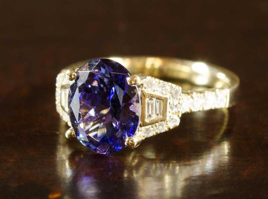 Appraisal: TANZANITE DIAMOND AND FOURTEEN KARAT GOLD RING with round-cut and