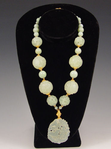 Appraisal: CHINESE CARVED SERPENTINE NECKLACE Polished and pierce carved beads and