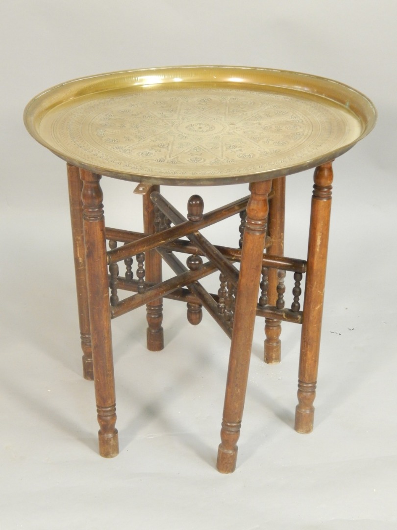 Appraisal: A Middle Eastern Benares type brass tray and stand the