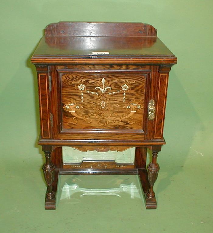 Appraisal: An Edwardian rosewood table cabinet with single door having floral