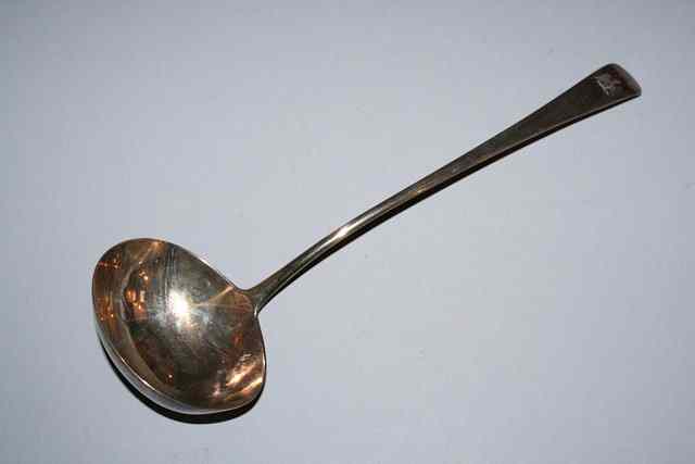 Appraisal: A GEORGE III SILVER OLD ENGLISH PATTERN SOUP LADLE long