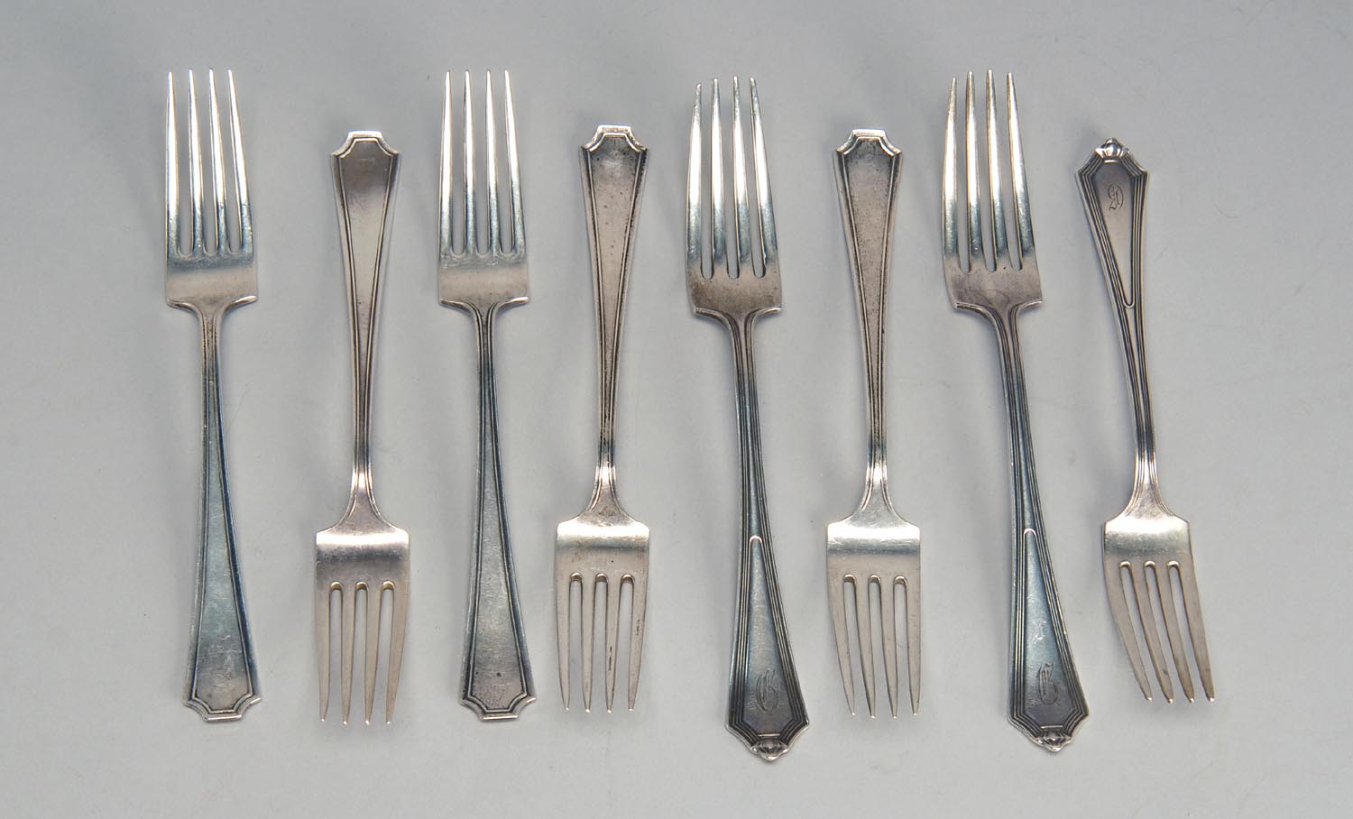 Appraisal: EIGHT STERLING SILVER DINNER FORKS Five by Durgin in the