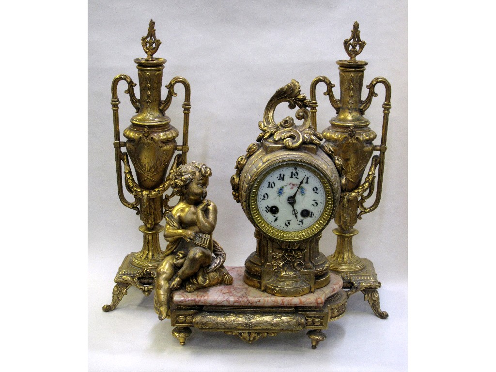 Appraisal: Gilt metal and marble mantle clock flanked by a gilt