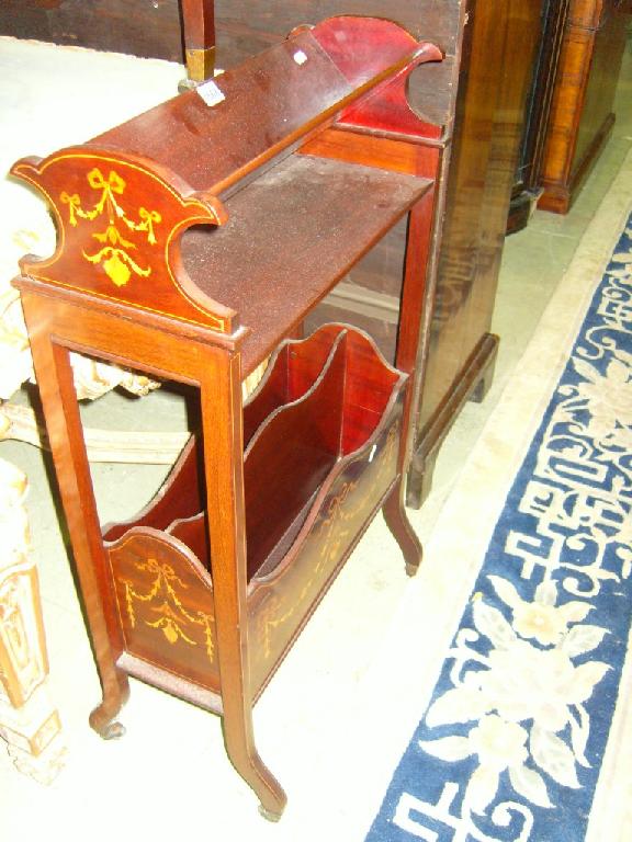 Appraisal: An Edwardian mahogany Canterbury and book rack with inlaid swag