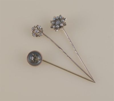 Appraisal: A gold stick pin set with five diamonds case a