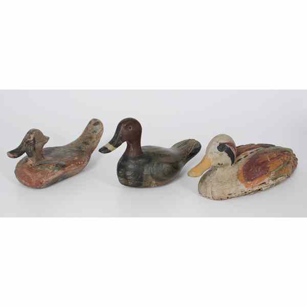 Appraisal: Wooden Decoys Three painted wooden bird decoys longest lg in