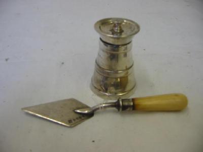 Appraisal: A PEPPER GRINDER of tapering form with flared and dished